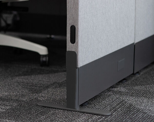 close up view of the bottom corner of a quickflex cube and the leveling foot at the bottom 